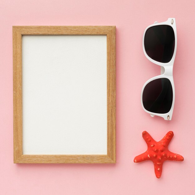 Free photo top view frame with summer glasses concept