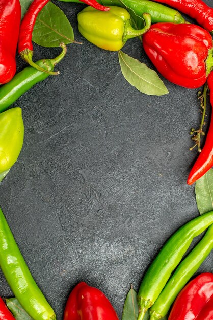 Top view framed cayenne with blank area different types of pepper plant on the background with free space