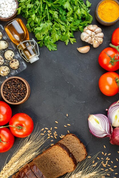 Top view of free space among delicious meatballs meal with potatoes green and fresh vegetables on black background