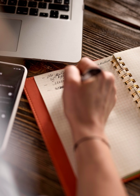 Top view freelance woman taking notes