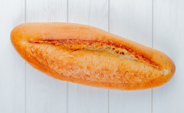 Top view of french baguette on wooden table