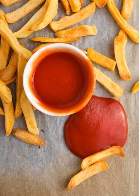 Top view of french fries with ketchup sauce