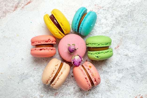 Top view french macarons delicious little cakes on white space