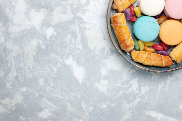 Top view french macarons with bagels on white