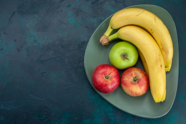 Top view fresh apples with bananas on dark-blue desk