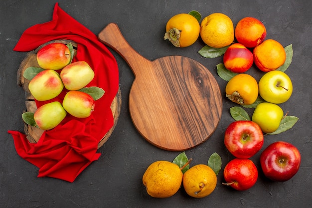 Top view fresh apples with other fruits on dark desk tree fresh ripe mellow