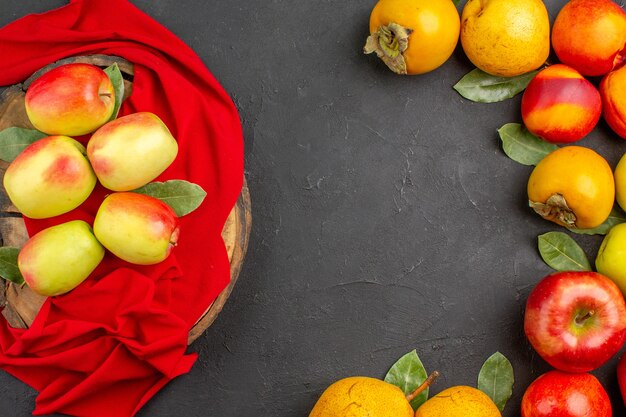 Top view fresh apples with other fruits on the dark table tree fresh ripe mellow