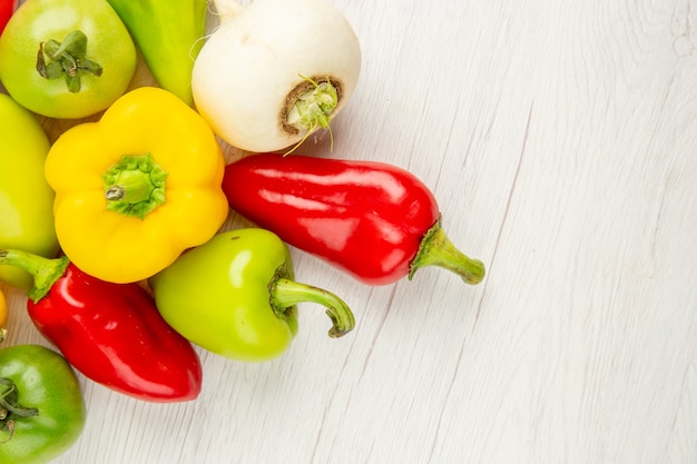 Top view fresh bell-peppers different colored on white background ripe  salad color