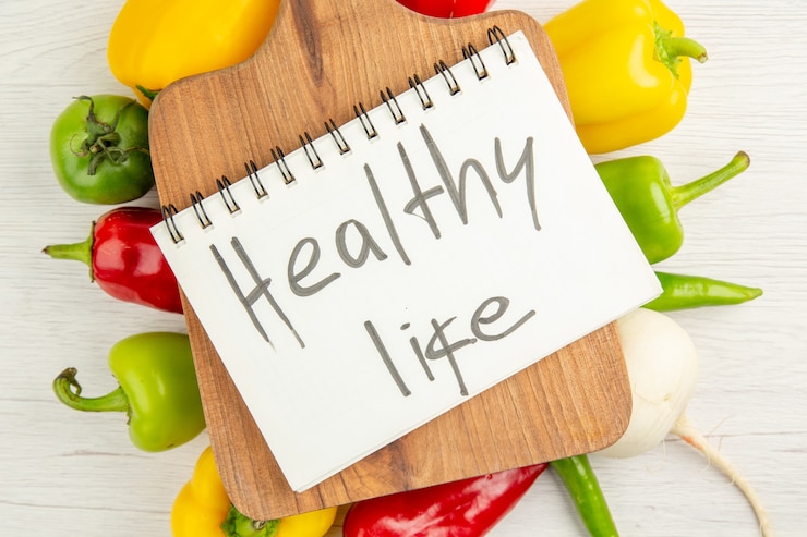 Free Photo top view fresh bell-peppers different colored with brown wooden desk on white background salad diet ripe meal color photo healthy life