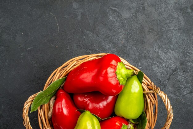 Top view fresh bell-peppers inside basket