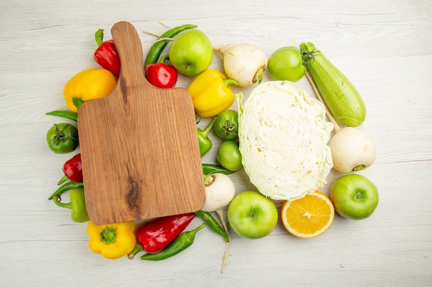 Top view fresh bell-peppers with apples and cabbage on white background color photo salad healthy life ripe diet