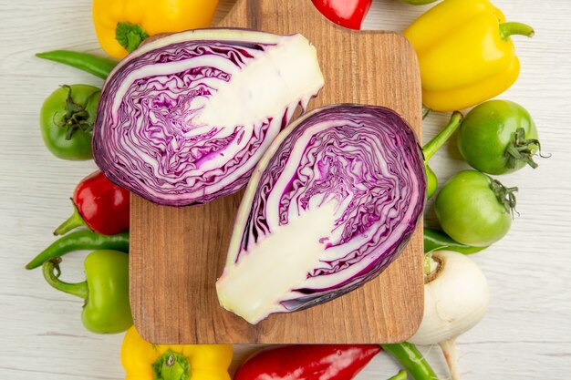 Top view fresh bell-peppers with apples and red cabbage on white background ripe color  healthy life diet salad