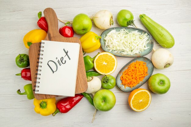 Top view fresh bell-peppers with apples on a white background color  salad healthy life ripe diet