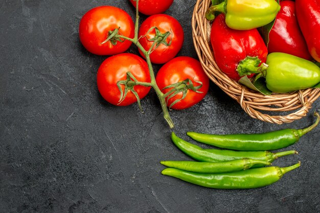 Top view fresh bell-peppers with red tomatoes