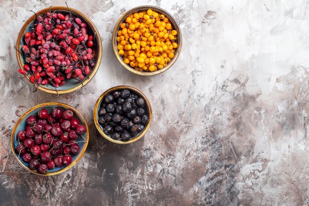 Top view fresh berries on light backgorund