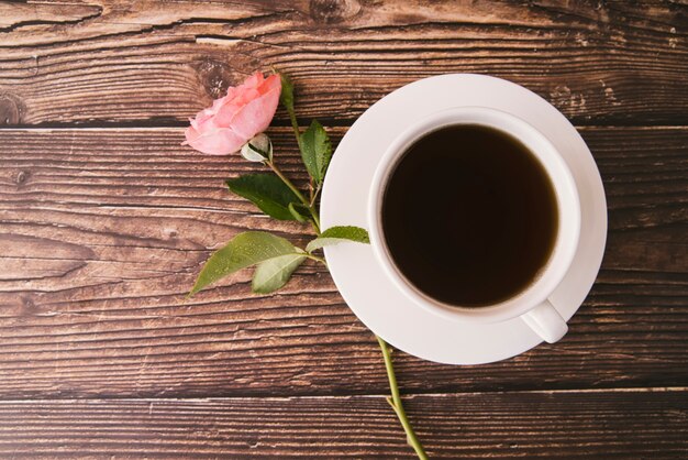 Top view fresh black coffee on wooden background