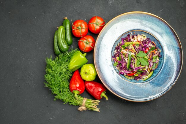 Top view fresh cabbage salad with greens and vegetables on dark background