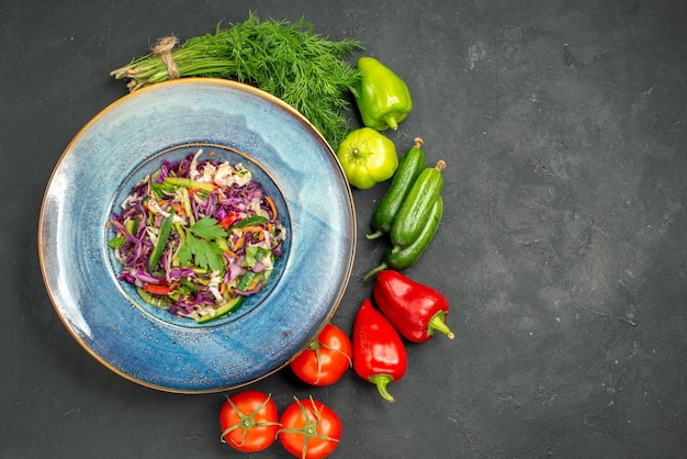 Top view fresh cabbage salad with greens and vegetables on dark background