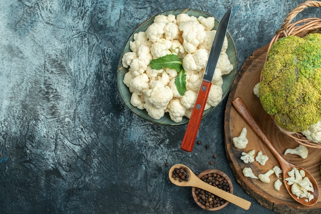 Top view fresh cauliflower inside basket on a light-grey table