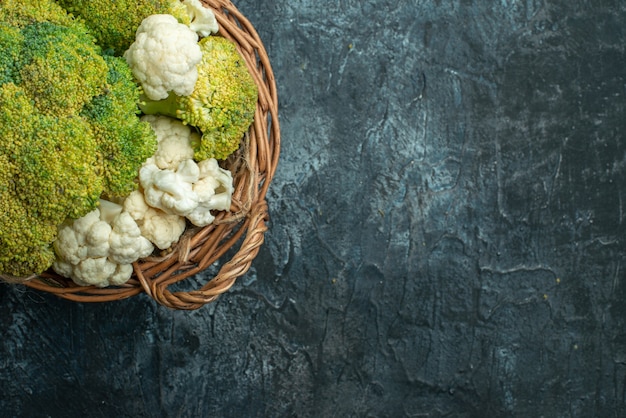 Top view fresh cauliflower inside basket on light-grey table