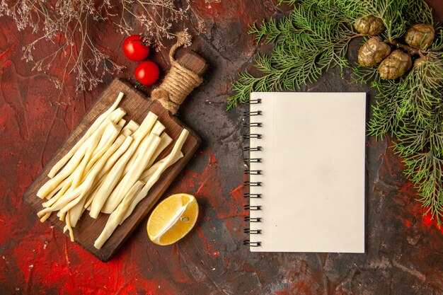 Top view fresh cheese sliced on wooden desk on dark background