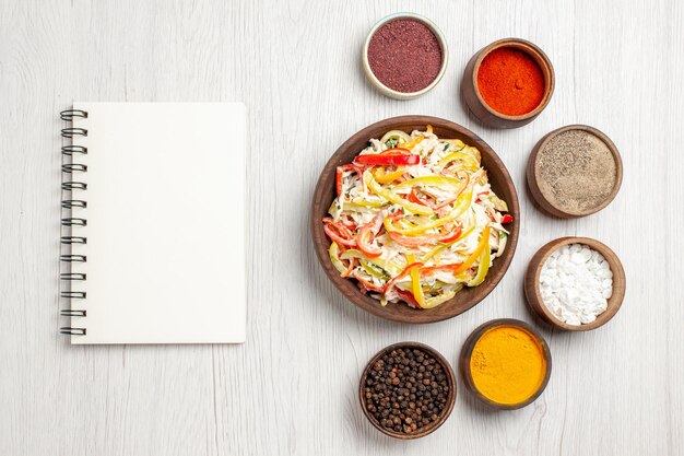 Top view fresh chicken salad with seasonings on the white desk snack meal meat fresh salad