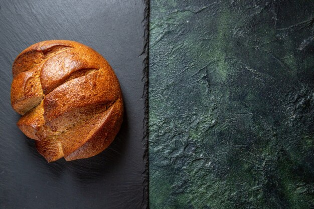 Top view fresh delicious bread on dark desk