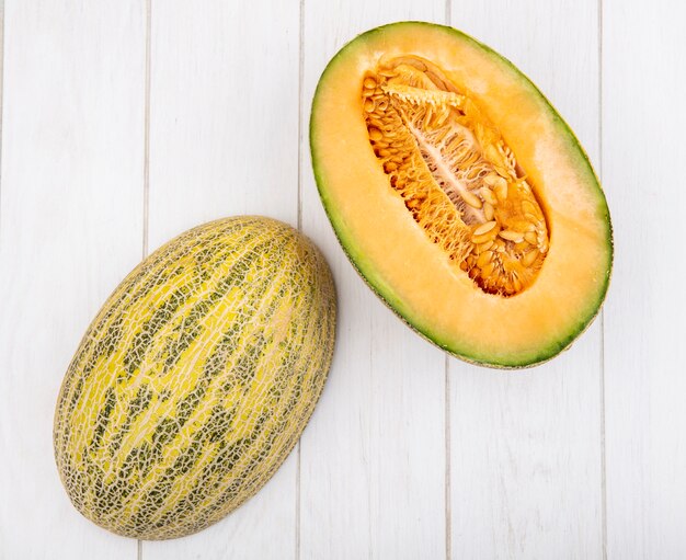 Top view of fresh and delicious cantaloupe melon slices on white