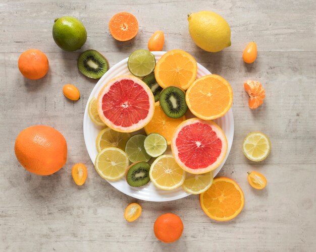 Top view fresh and exotic fruits on a plate