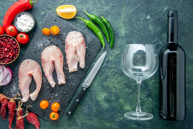 Top view fresh fish slices on dark background dish salad seafood ocean meat sea wine pepper food water meal