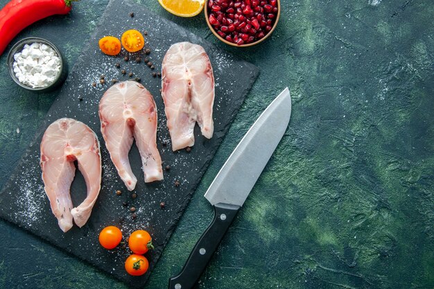 Top view fresh fish slices on dark background salad seafood ocean meat sea meal dish water pepper food