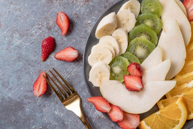 Top view fresh fruit salad with kiwi and banana