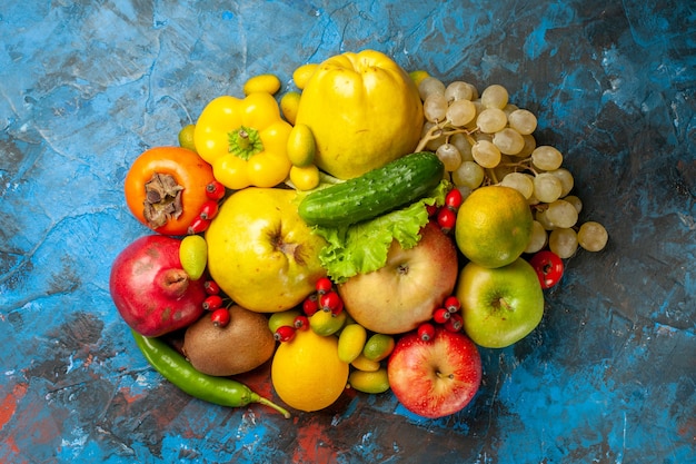 Top view fresh fruits on a blue background