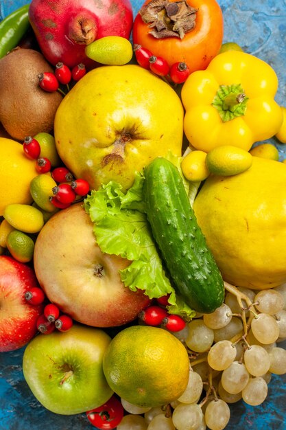 Top view fresh fruits on blue background