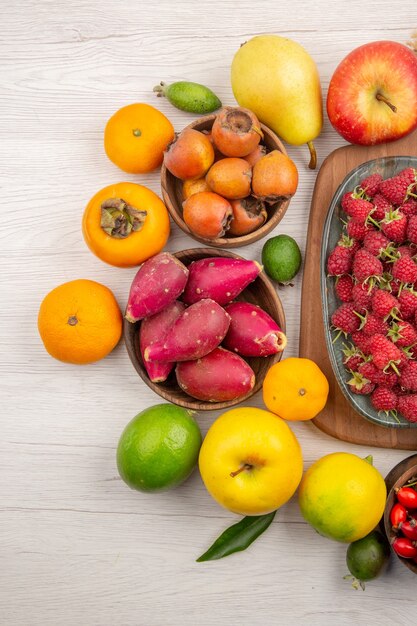 Top view fresh fruits composition different fruits on a white background