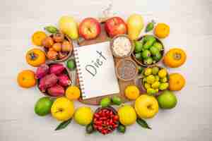 Free photo top view fresh fruits composition different fruits on a white background