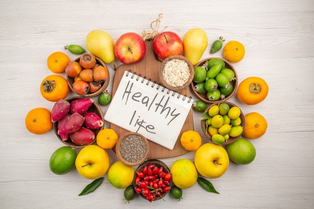 Top view fresh fruits composition different fruits on white background