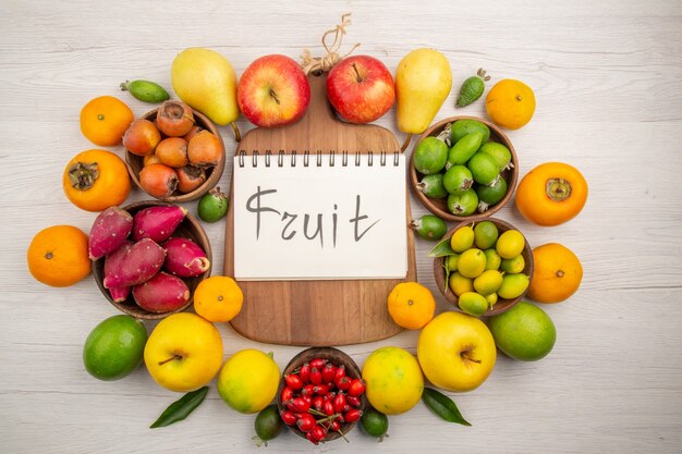 Top view fresh fruits composition different fruits on white background