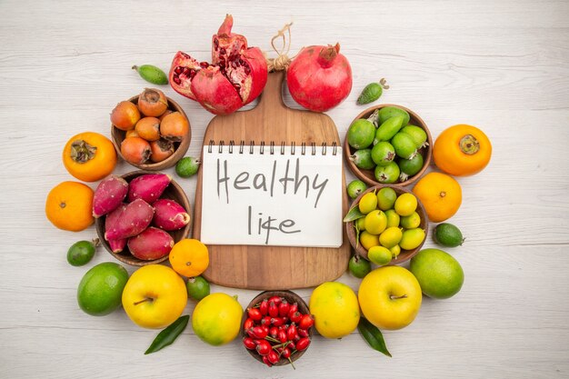 Top view fresh fruits composition different fruits on white background