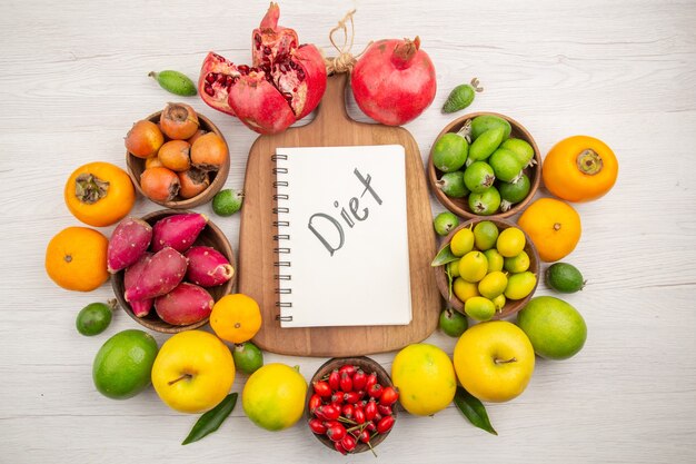 Top view fresh fruits composition different fruits on white background