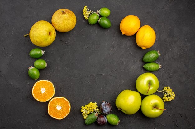 Top view fresh fruits composition mellow ripe fruits on a dark surface ripe fruit vitamine fresh mellow