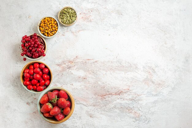 Top view fresh fruits different berries on white table fruit berry fresh taste