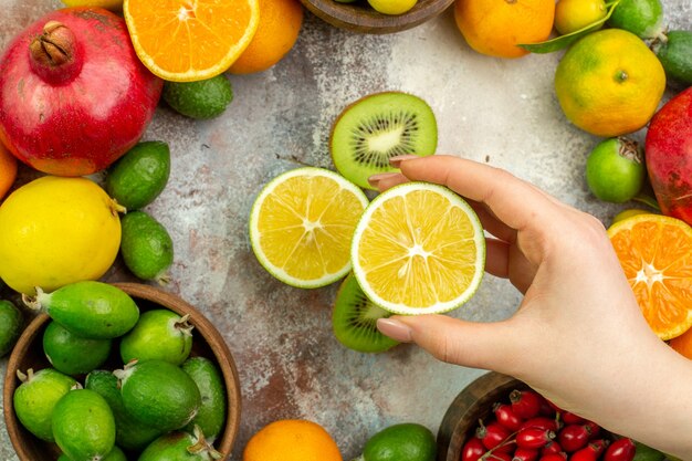 Top view fresh fruits different mellow fruits on the white background citrus health tree color berry ripe tasty photo