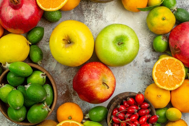 Top view fresh fruits different mellow fruits on white background health tree color  berry citrus ripe