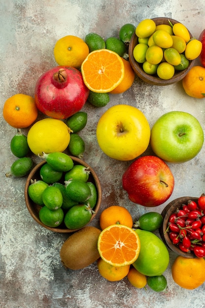 Top view fresh fruits different mellow fruits on white background health tree color tasty  berry citrus