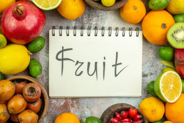 Top view fresh fruits different mellow fruits on white background tree tasty photo ripe diet color health berry