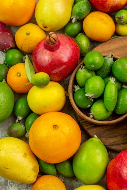 Top view fresh fruits different ripe and mellow fruits on the white background berry diet photo tasty health color