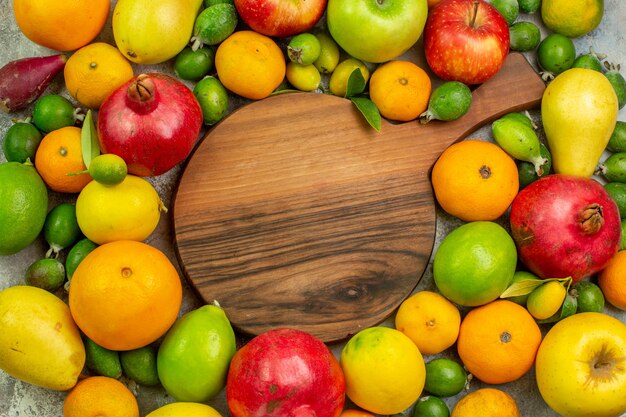 Top view fresh fruits different ripe and mellow fruits on white background