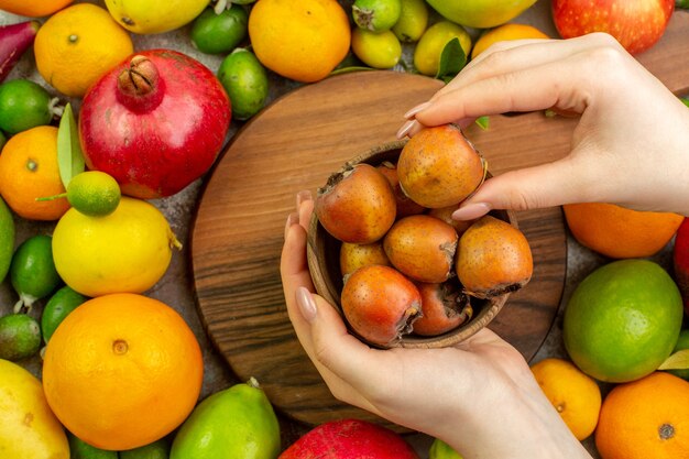 Top view fresh fruits different ripe and mellow fruits on white desk