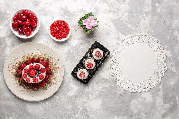 Top view fresh fruits dogwoods strawberries on a white space